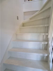 Faded, dull staircase awaiting a vibrant transformation